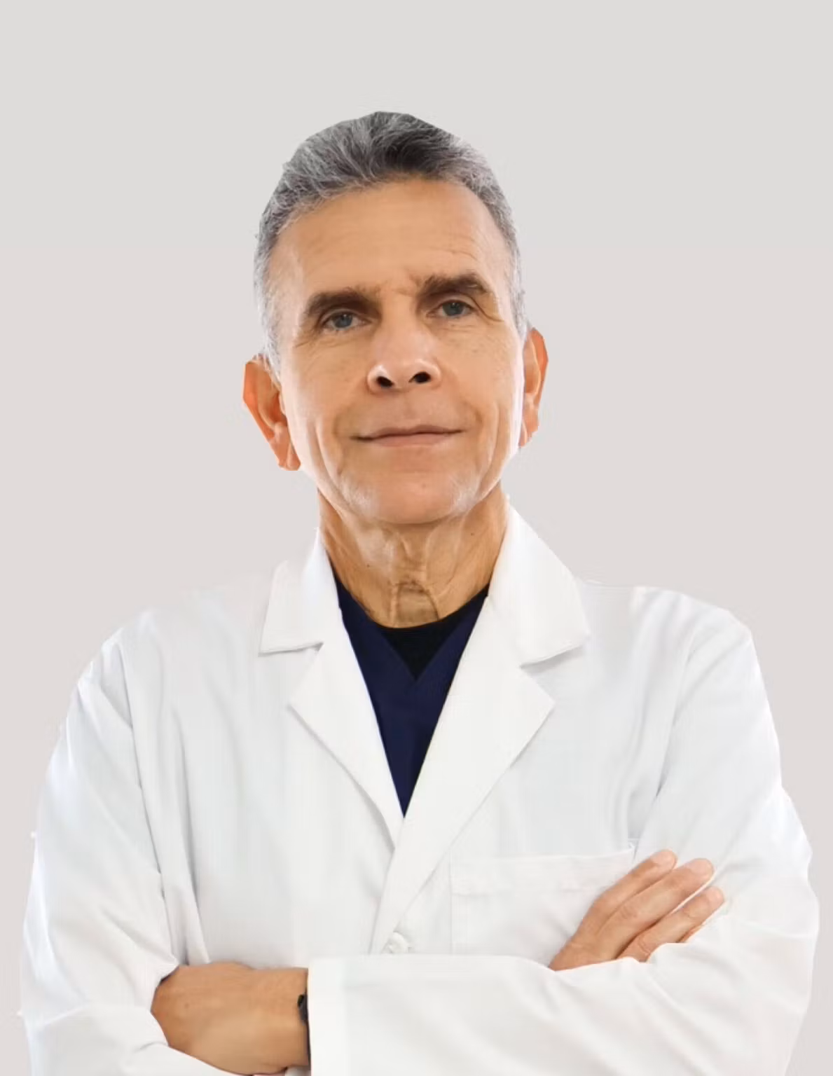 Dr. Jorge Ramos Mendoza, DMD, wearing a white coat